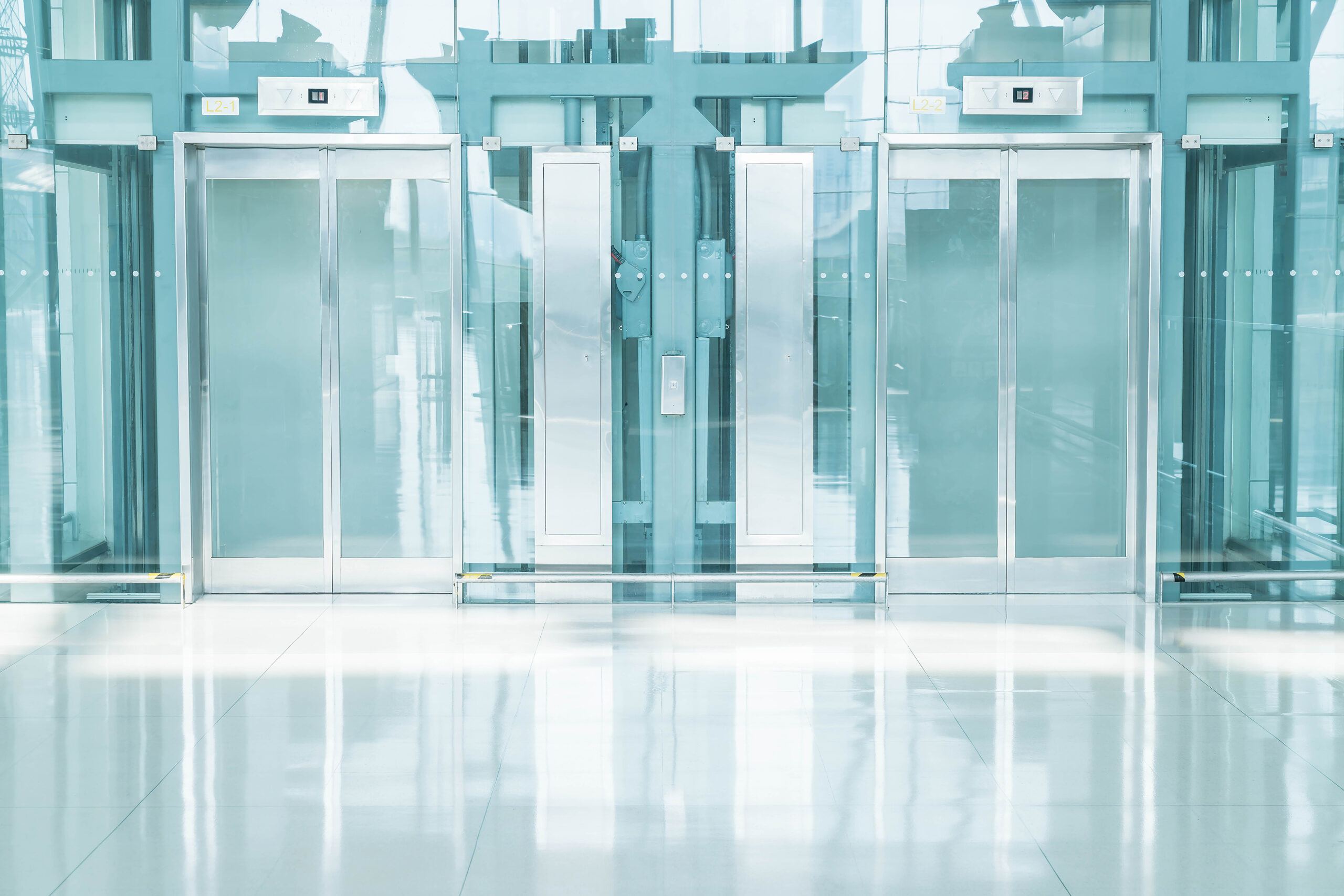Transparent elevator in underground passage - blue white balance processing